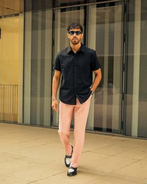 Black Short-Sleeve Shirt with Pink Trousers and Loafers