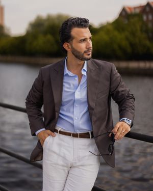 Brown Blazer with Light Blue Shirt and White Linen Trousers