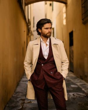 Beige trench coat with maroon wool suit	