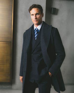 Coat with Pinstriped Suit and Blue Tie