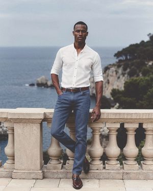 Ivory Linen Shirt with Blue Jeans and Brown Loafers