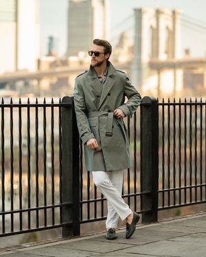 Sage Green Trench Coat with Light Grey Shirt and White Trousers